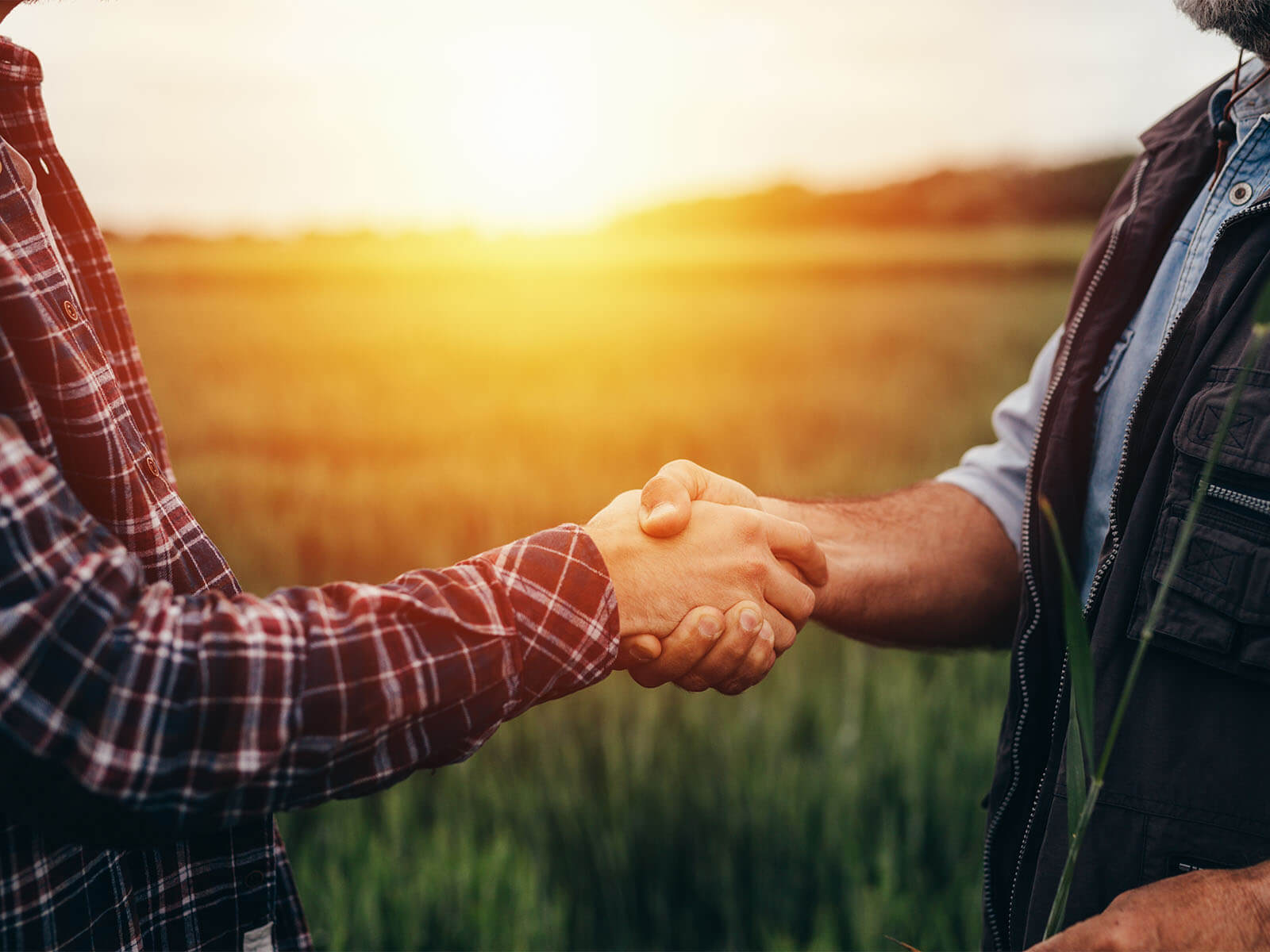 Harvex farm supply farmers shaking hands