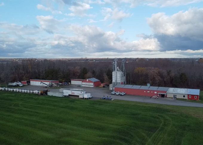 Harvex Agromart location with green crop and blue skies