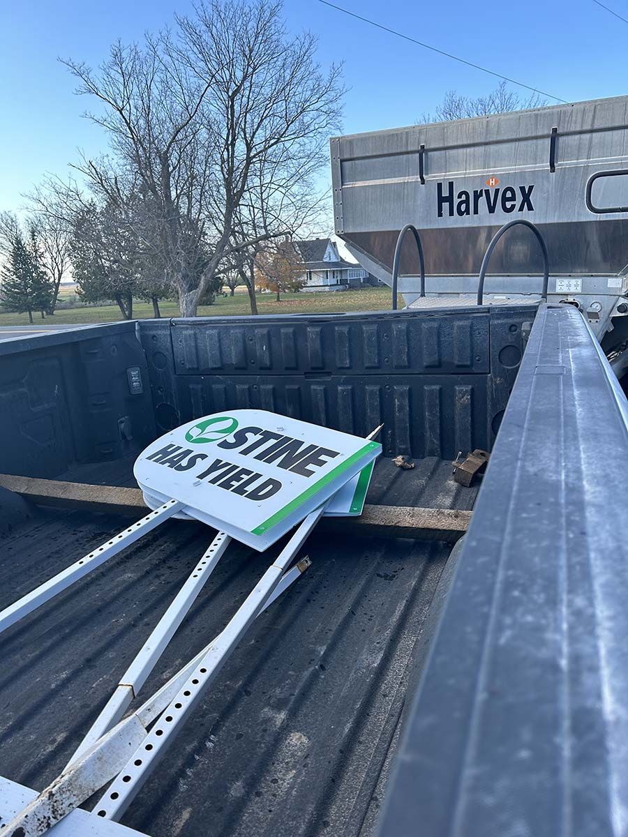 Stine Seeds signs inside truck Summit Seeds